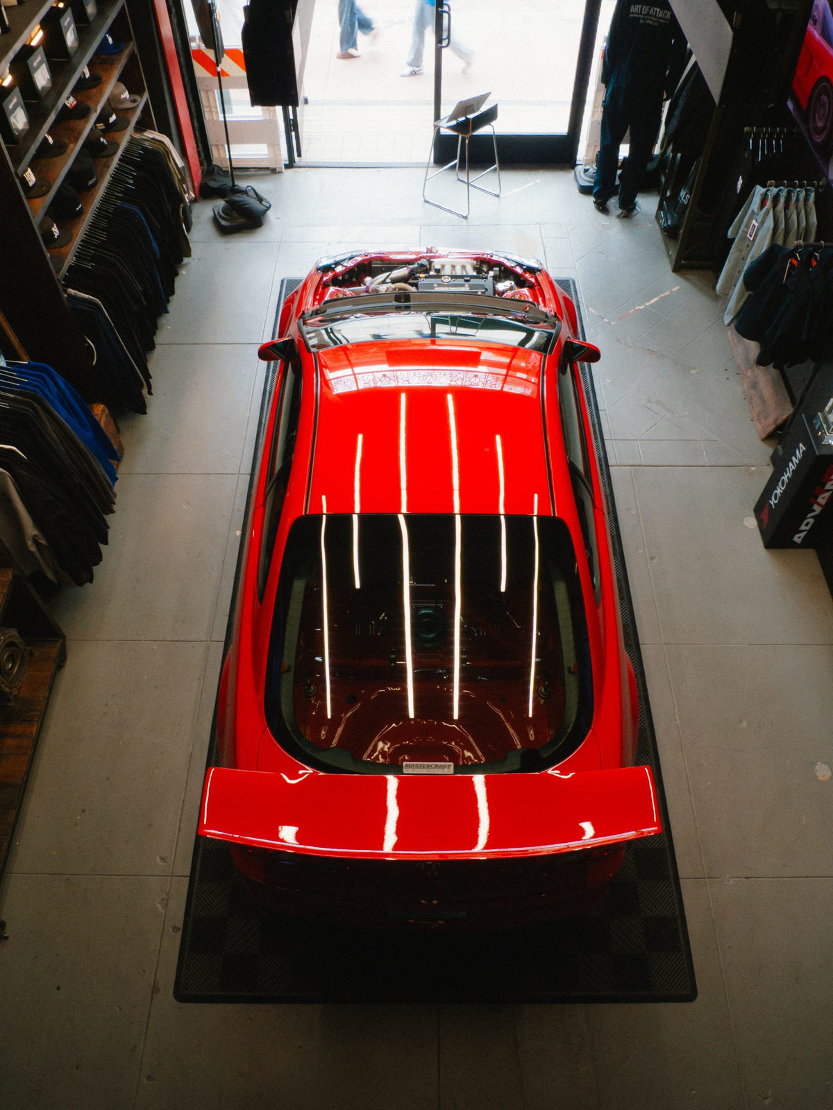 A red DC5 on display inside the BOWLS shop, seen from above