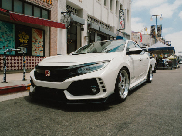 A white Civic Type R on 1st Street